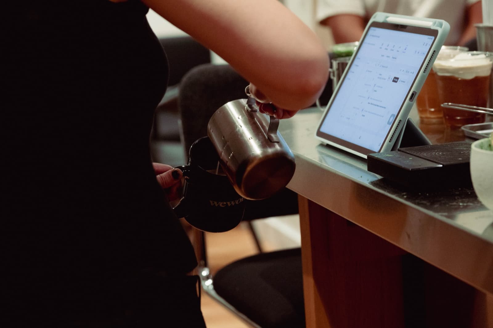 A barista preparing drinks at an event